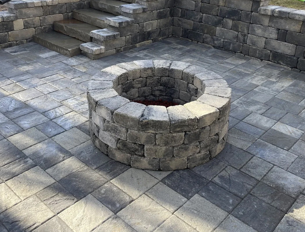Stone fire pit in a new stone outdoor patio